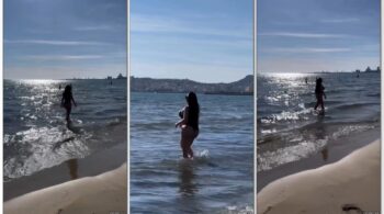 Sheyla Mell, uma celebridade do OnlyFans, aproveitando o dia ensolarado na praia com um biquíni cavado