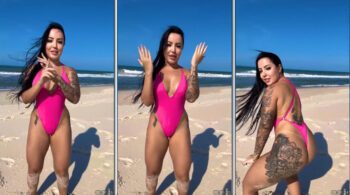 Morena Brena Barbosa dançando de forma provocante na areia com um maiô bem cavado realçando suas curvas