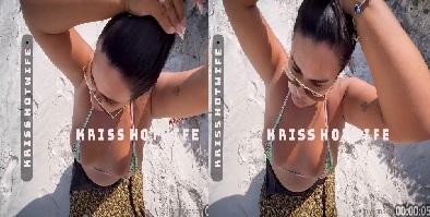 Kriss Hot Wife fazendo um oral para seu parceiro na areia