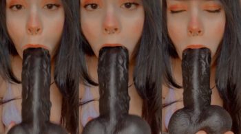 Lua Uchiha está fazendo boquete em um vibrador preto com a boca cheia em um local privado