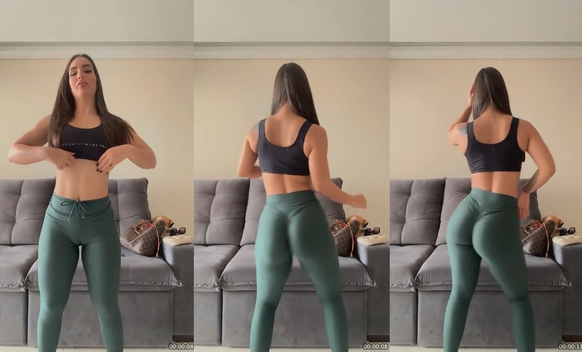 Mariana Casaroto dançando com uma calça justinha que realça suas curvas