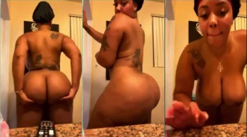 Mulher negra com muita atitude dançando sensualmente e mostrando seu belo bumbum